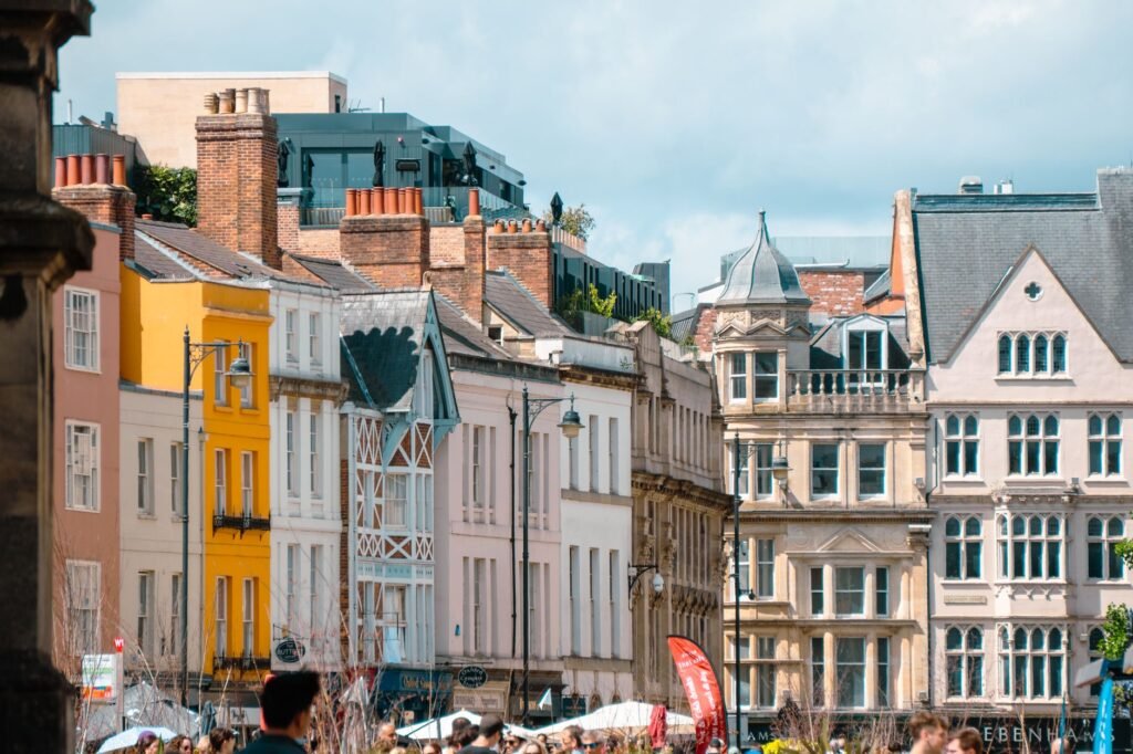 Charming view of a European street lined with vibrant, historic architecture on a clear day.