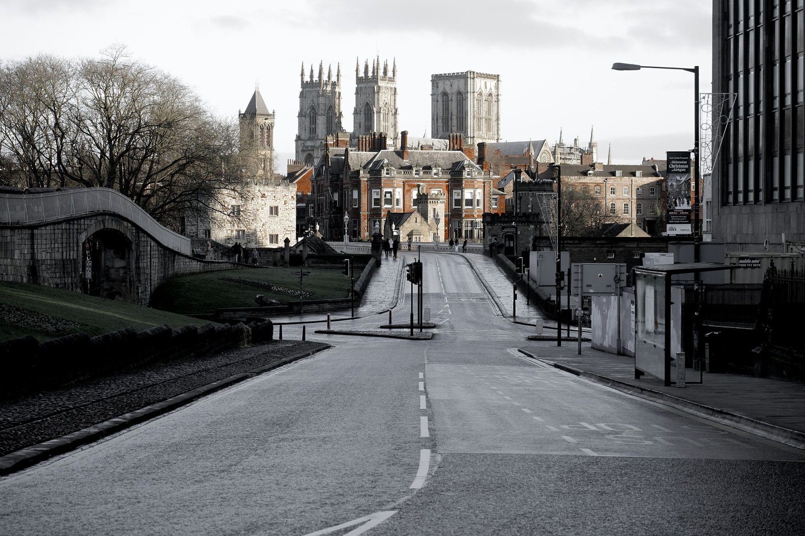 A striking shot of York Minster framed by an empty city street, highlighting historic architecture.