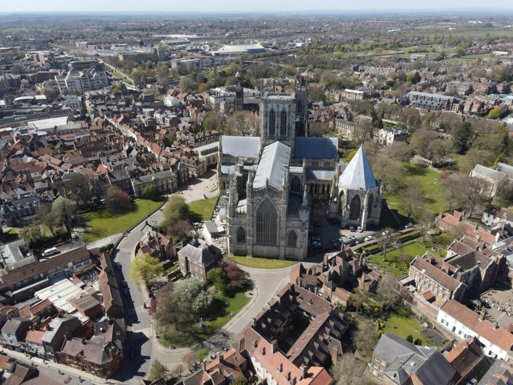 Aerial view of historic York Minster and surrounding cityscape in England.