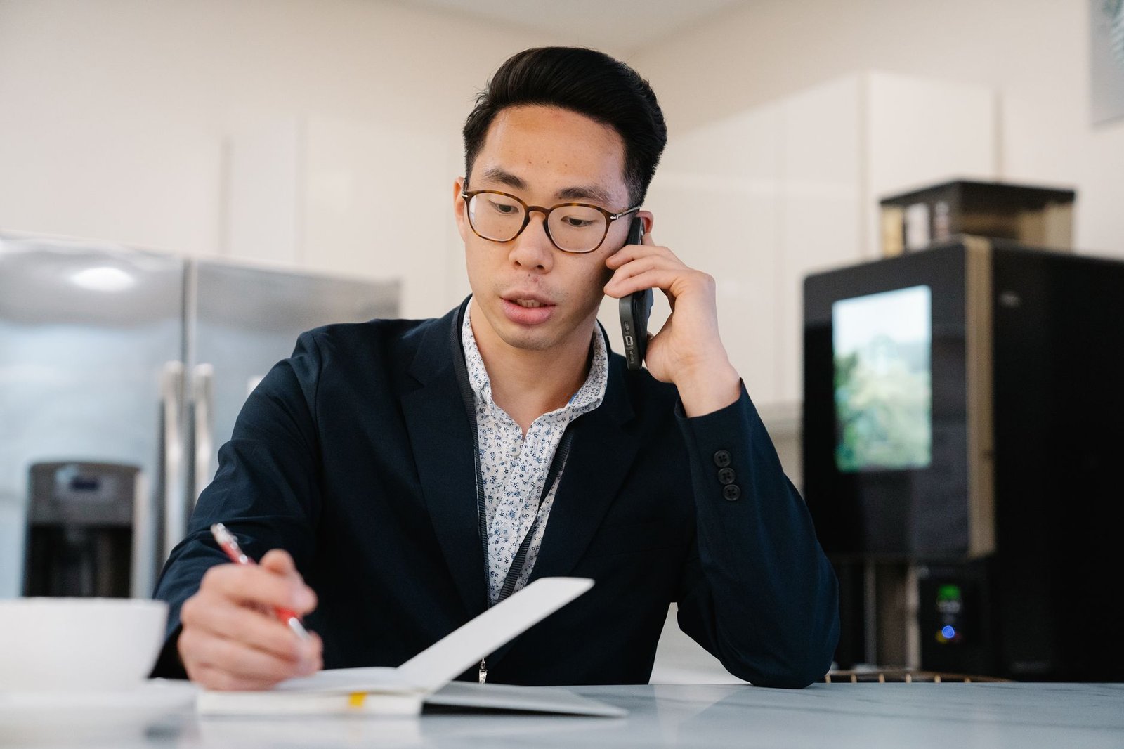 Well-dressed man checking his phone before a first meeting