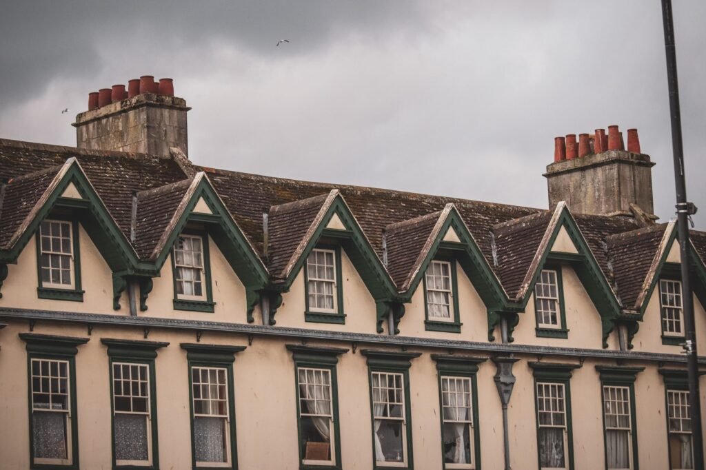Charming Victorian buildings in Bath, UK showcasing classic architecture under a cloudy sky.