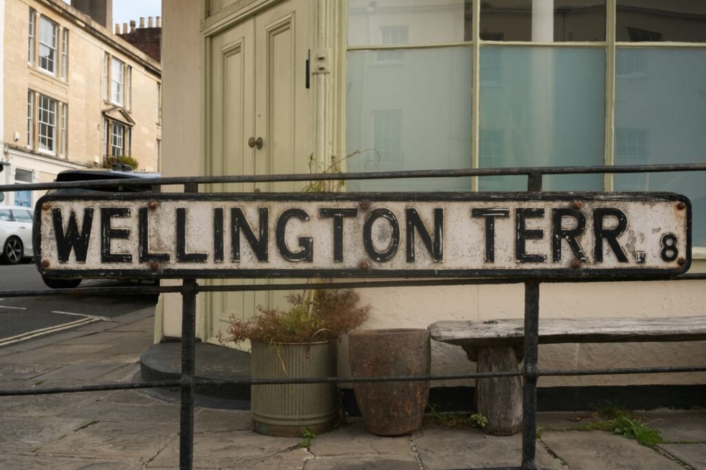 Rustic street sign for Wellington Terrace in Bristol, England showing an old-world charm.