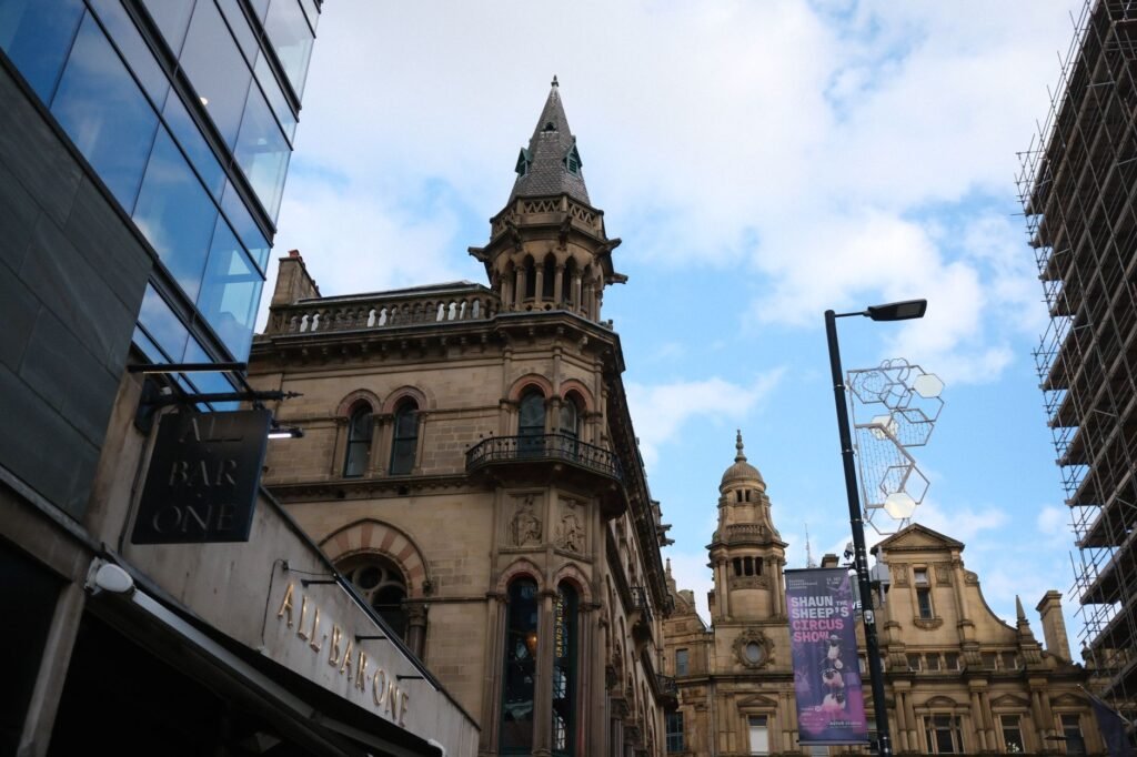 Street view focusing on charming Victorian-era architecture with a clear blue sky as the backdrop.