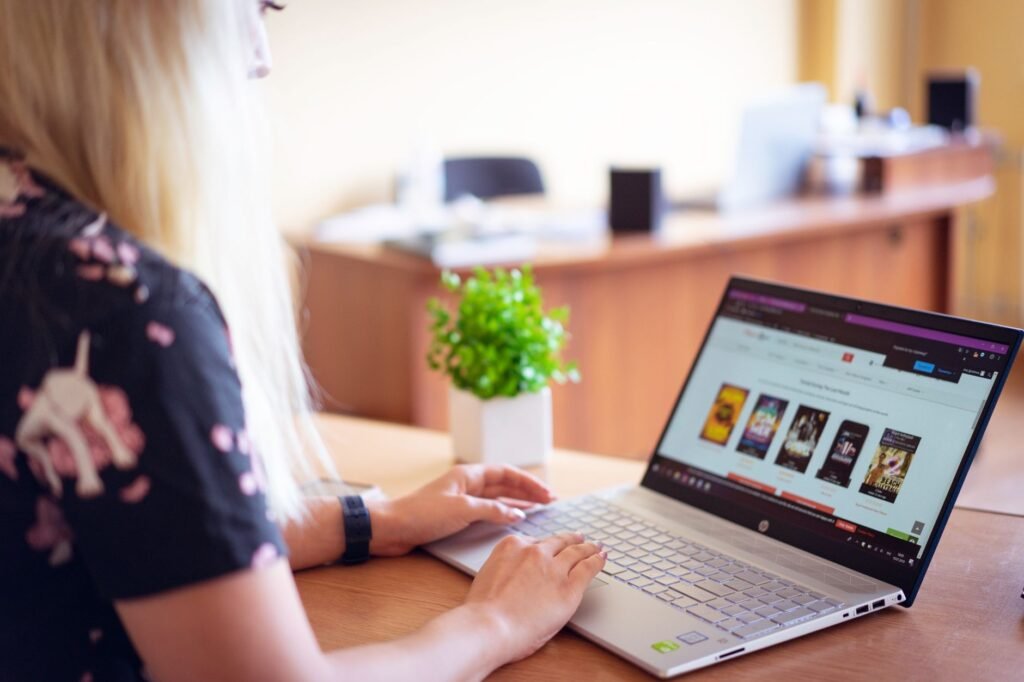 Person comparing online profiles on a laptop