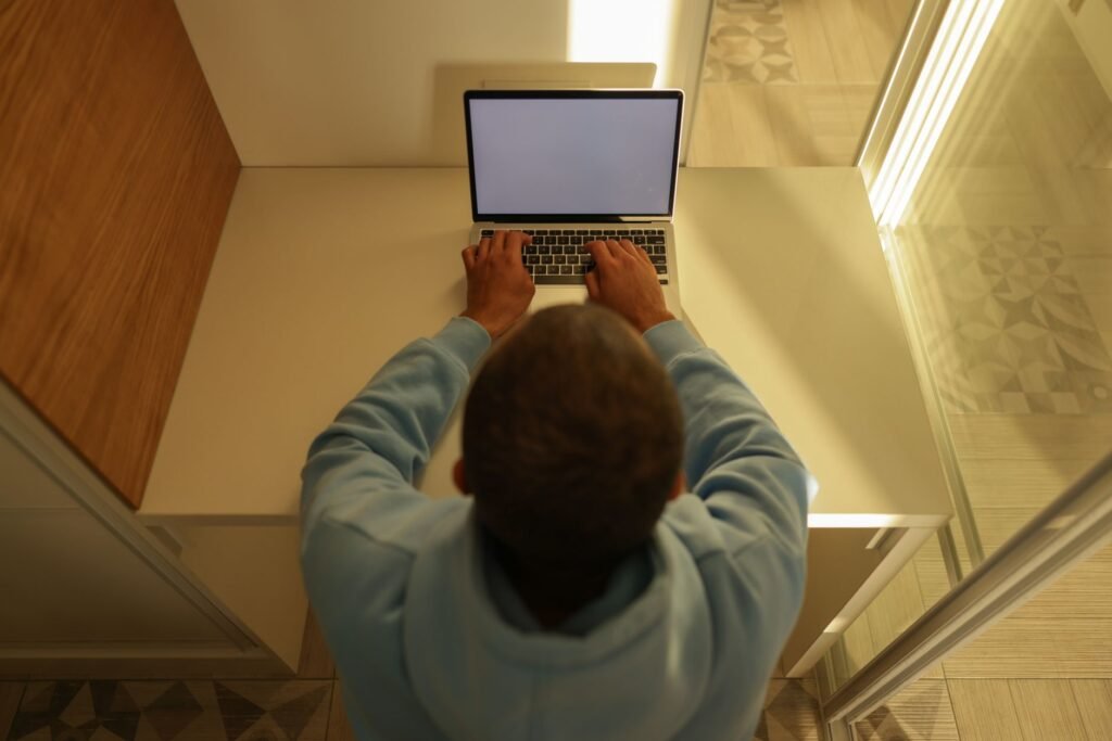 Adult browsing directory information on a laptop
