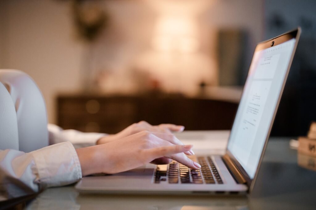 Adult reviewing profile and booking information on a laptop