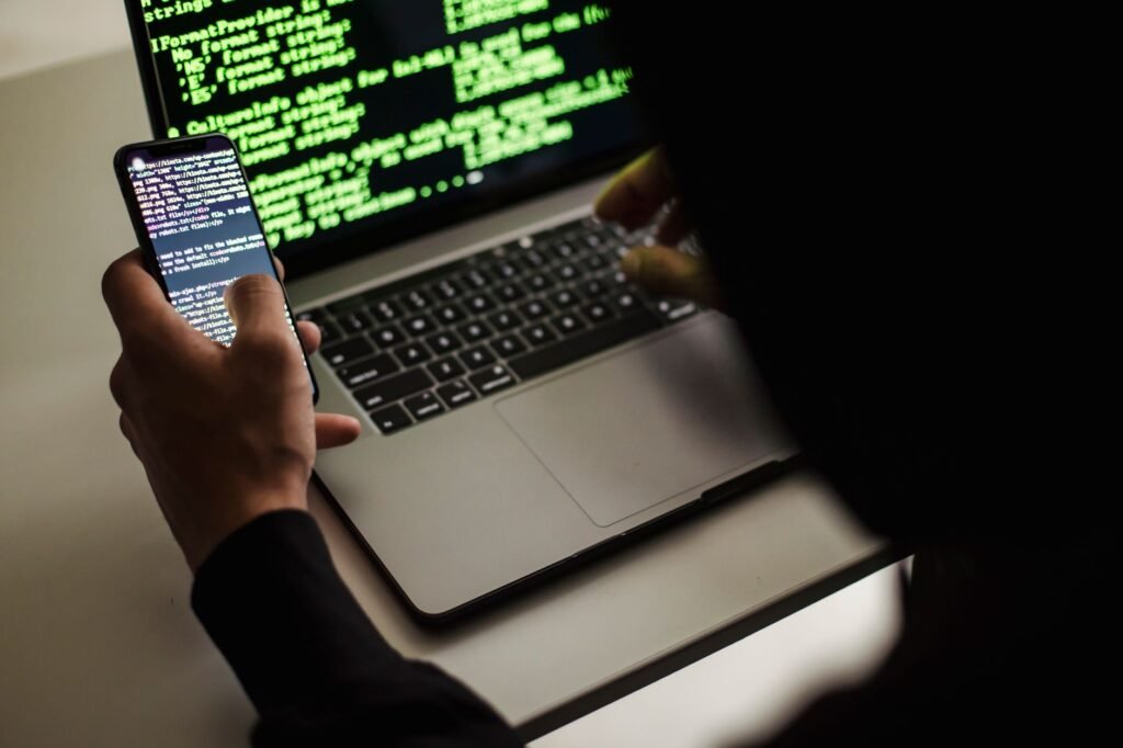 Person reviewing an online profile privately on a laptop