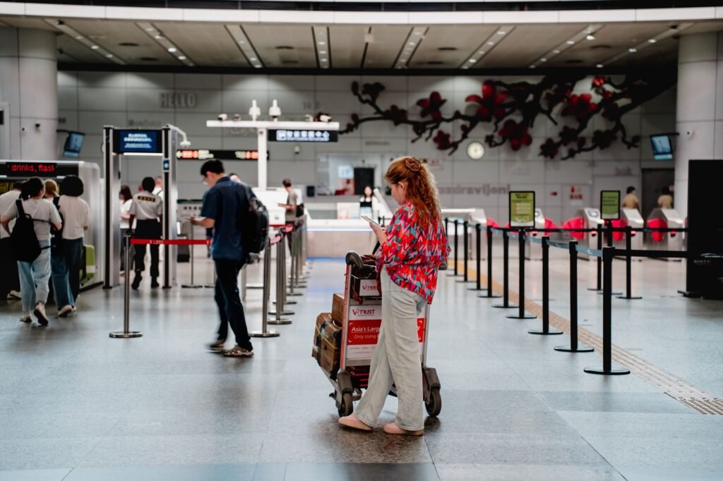 Adult traveller checking plans and route information