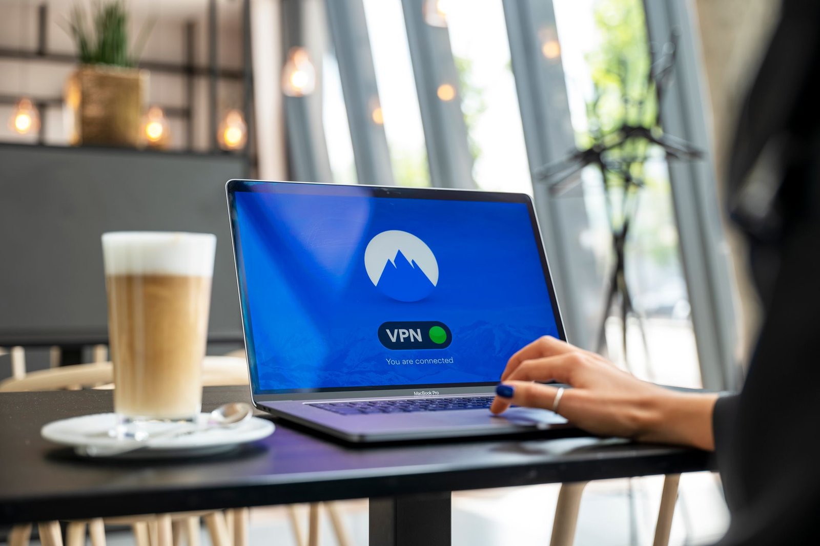 Adult traveller reviewing private booking information on a laptop