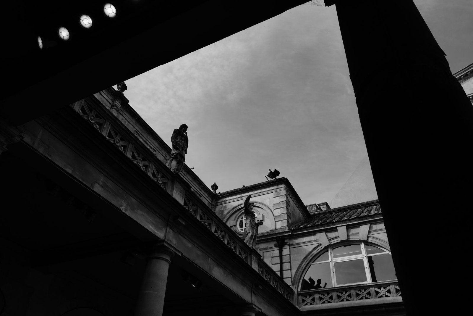 Traveller discreetly reviewing information on a smartphone in Bath