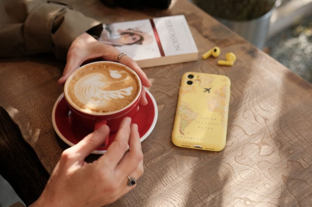 Phone and travel planning items beside a Bristol map