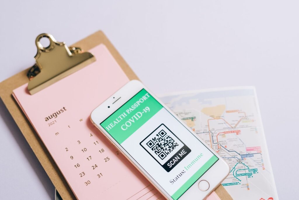 A phone and checklist used to confirm booking details