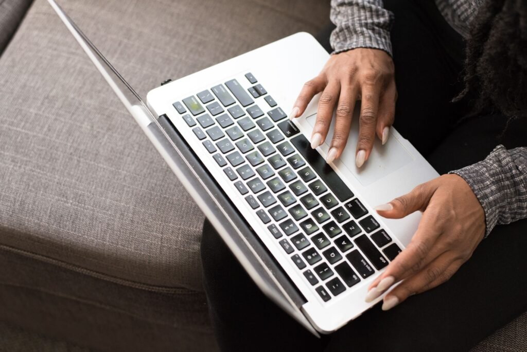 Person reviewing a profile privately on a laptop