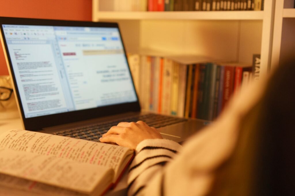 Adult reviewing profile information and writing a careful enquiry