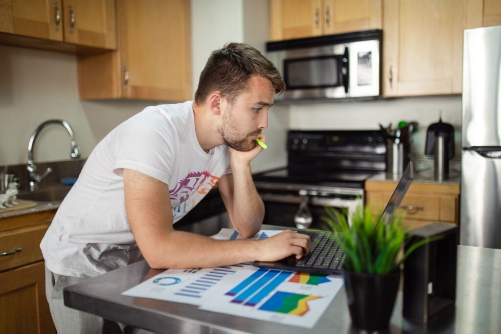 Adult reading a directory profile on a laptop