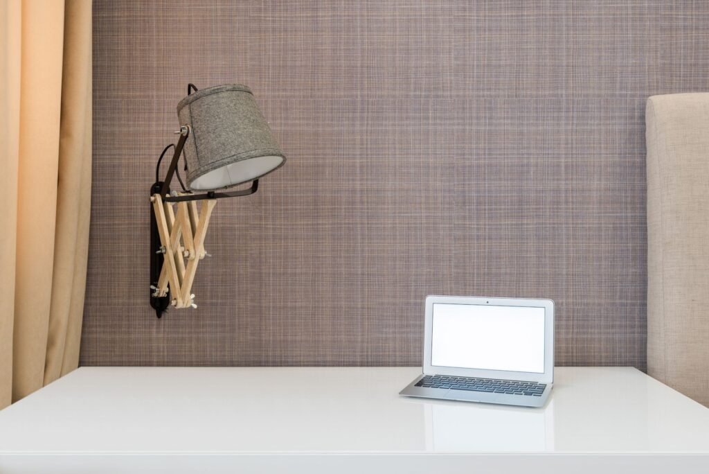 Visitor reviewing information on a laptop before making an enquiry