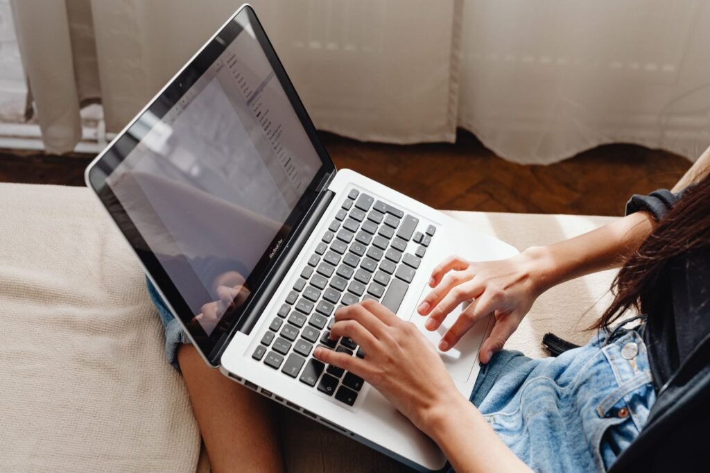 Adult reviewing online information privately on a laptop