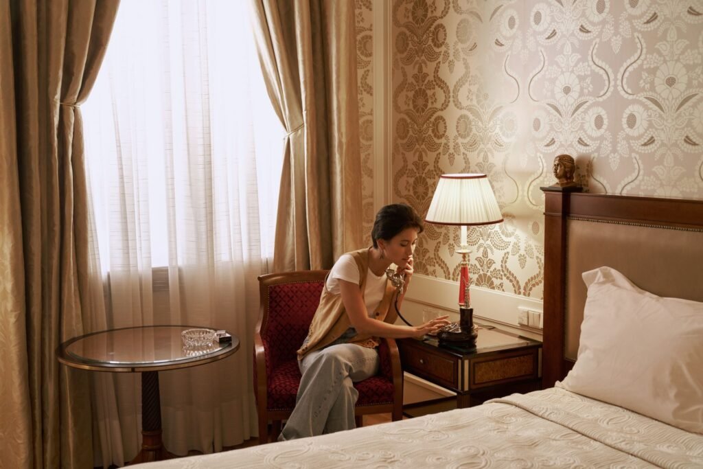 Phone and keys on a hotel bedside table during private travel planning
