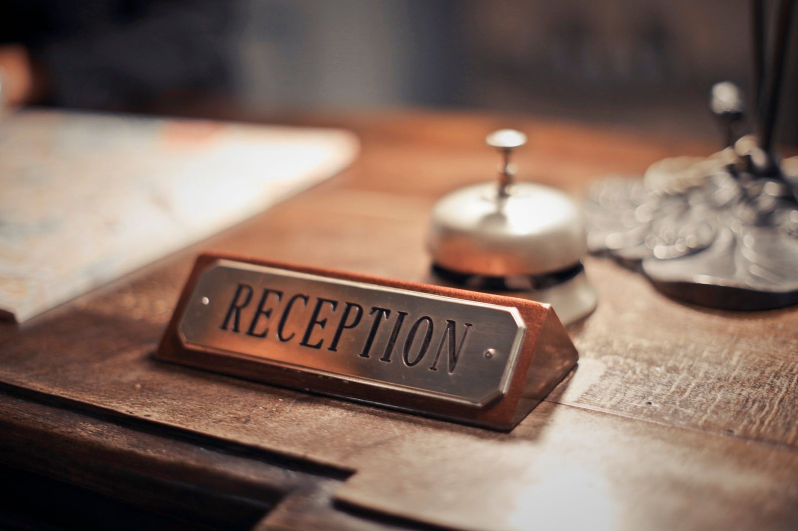 A discreet hotel desk with a phone and notebook for planning a visit to Southampton