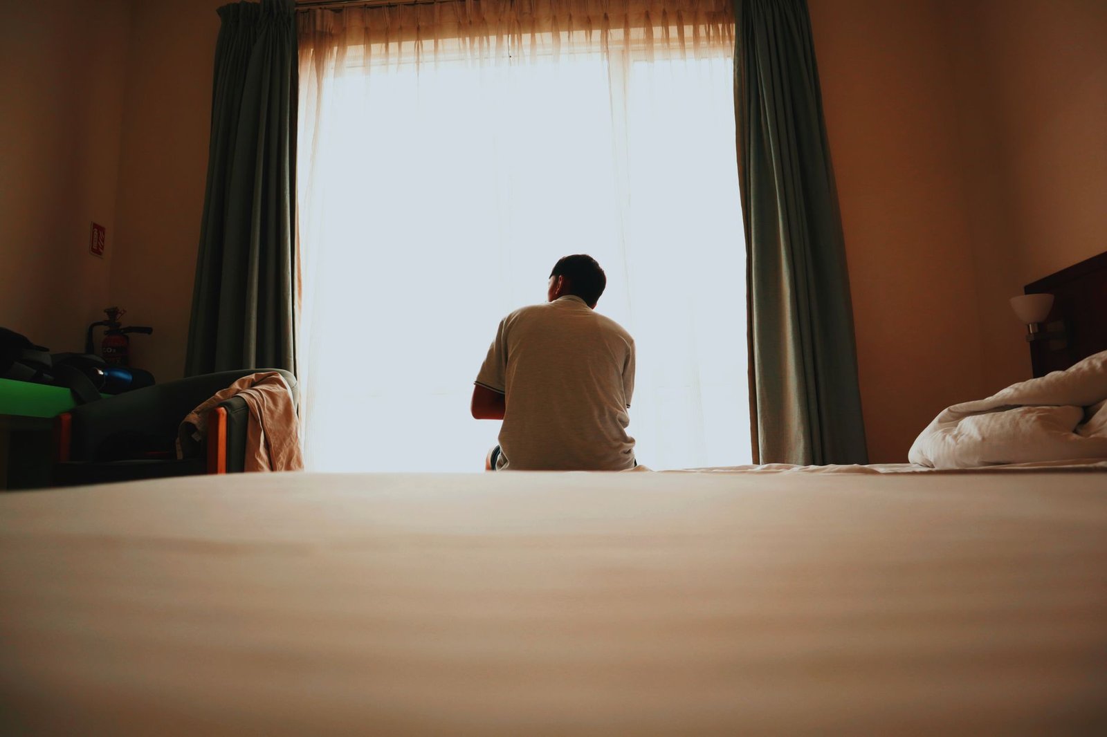 Adult traveller reviewing an online directory privately on a laptop
