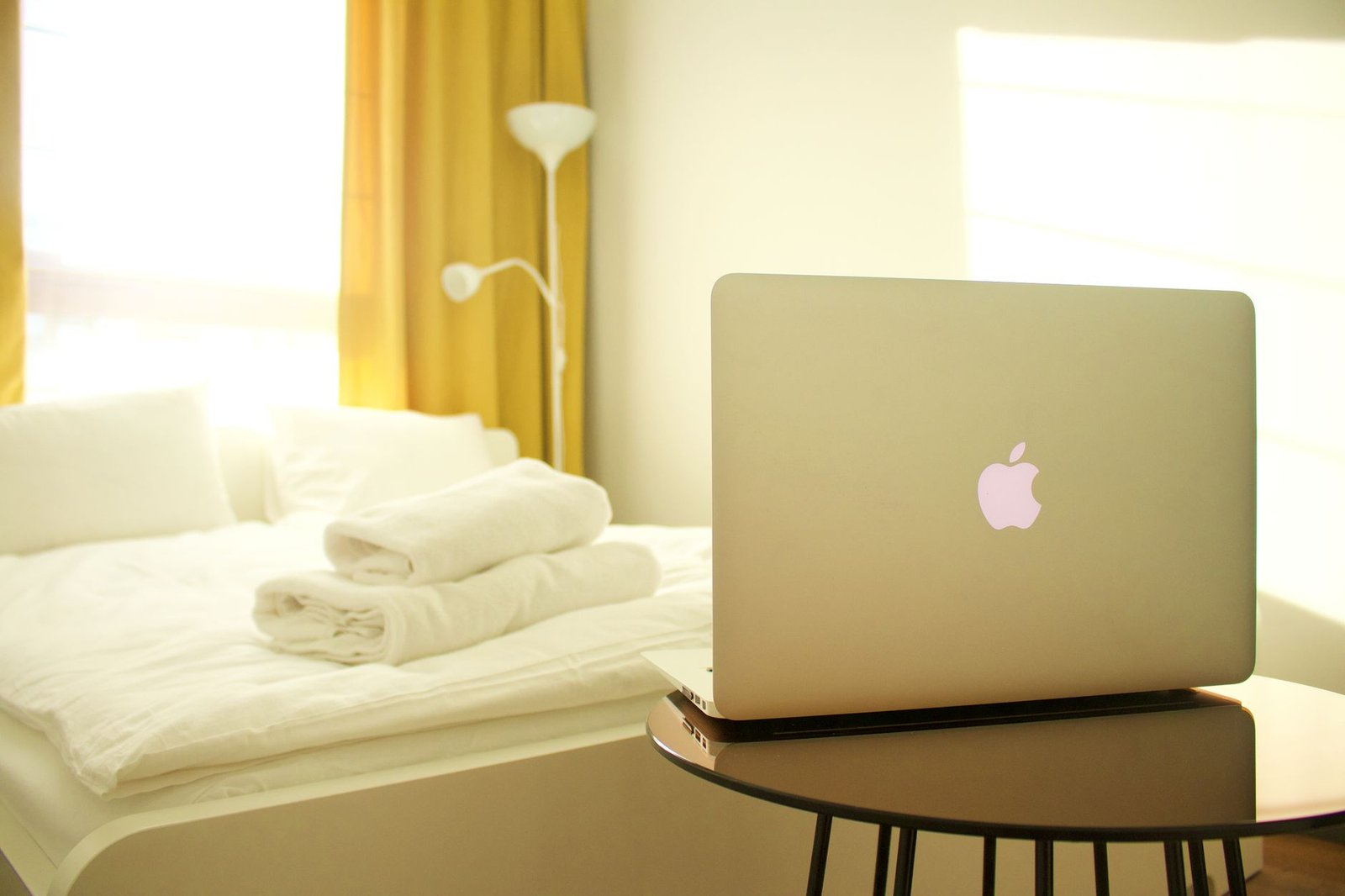 Traveller reviewing an online directory privately on a laptop