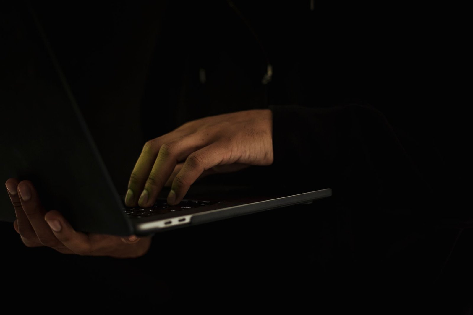 Adult traveller reviewing a directory privately on a laptop in Wolverhampton
