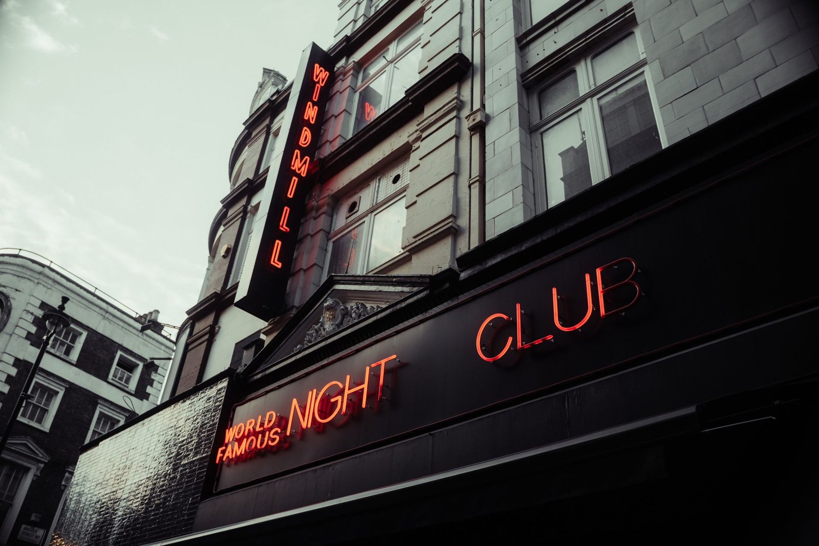 Low angle shot of the Windmill Nightclub with neon lights, London.