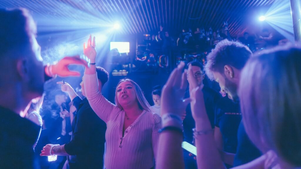A lively nightclub scene with people dancing and enjoying the vibrant atmosphere.