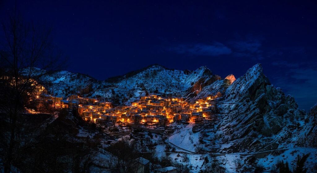 castelmezzano, town, illuminated, commune, snow mountains, townscape, italy, village, mountains, winter, snow, night, evening