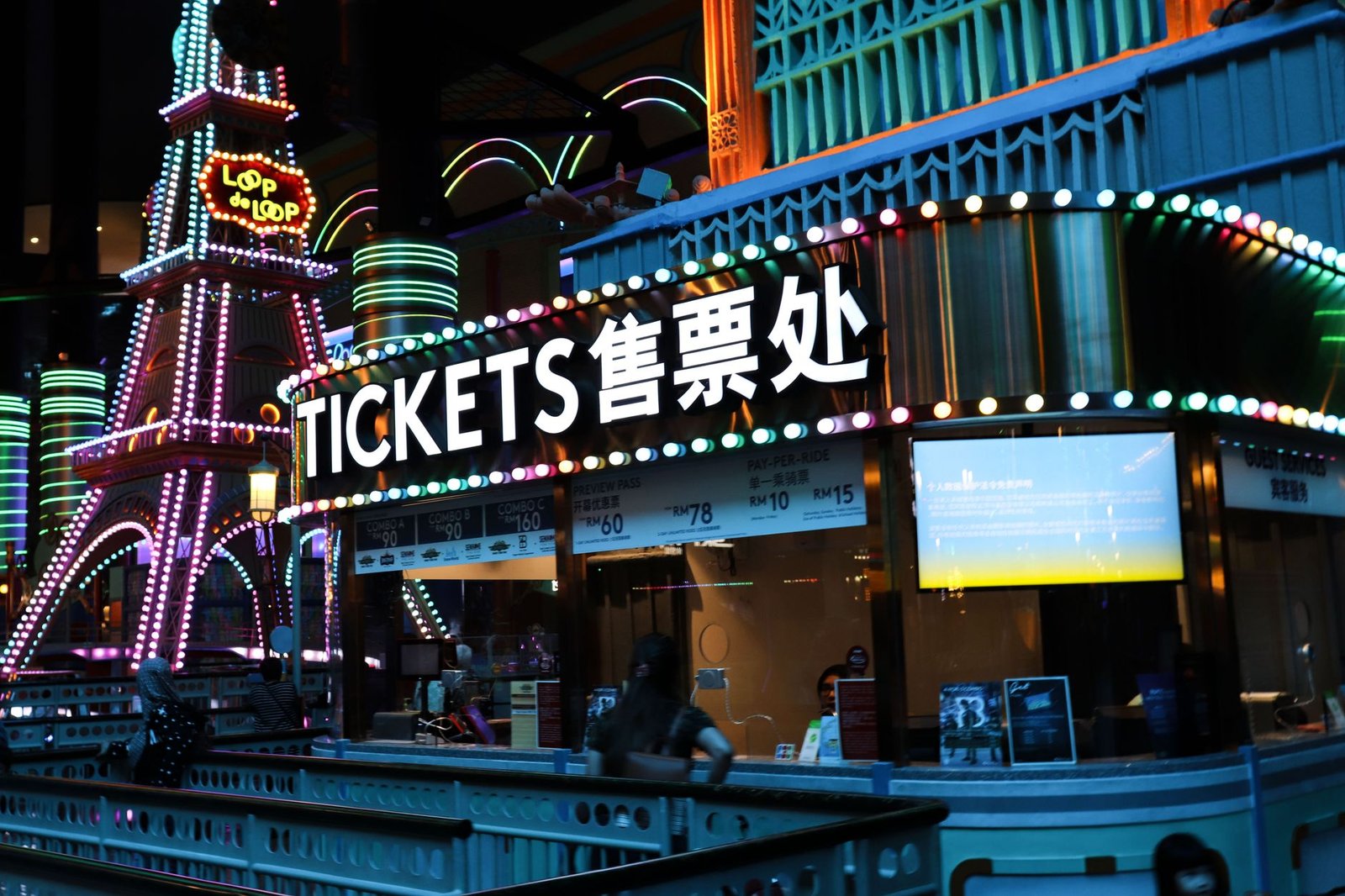 Two adults meeting before an evening live event with digital tickets