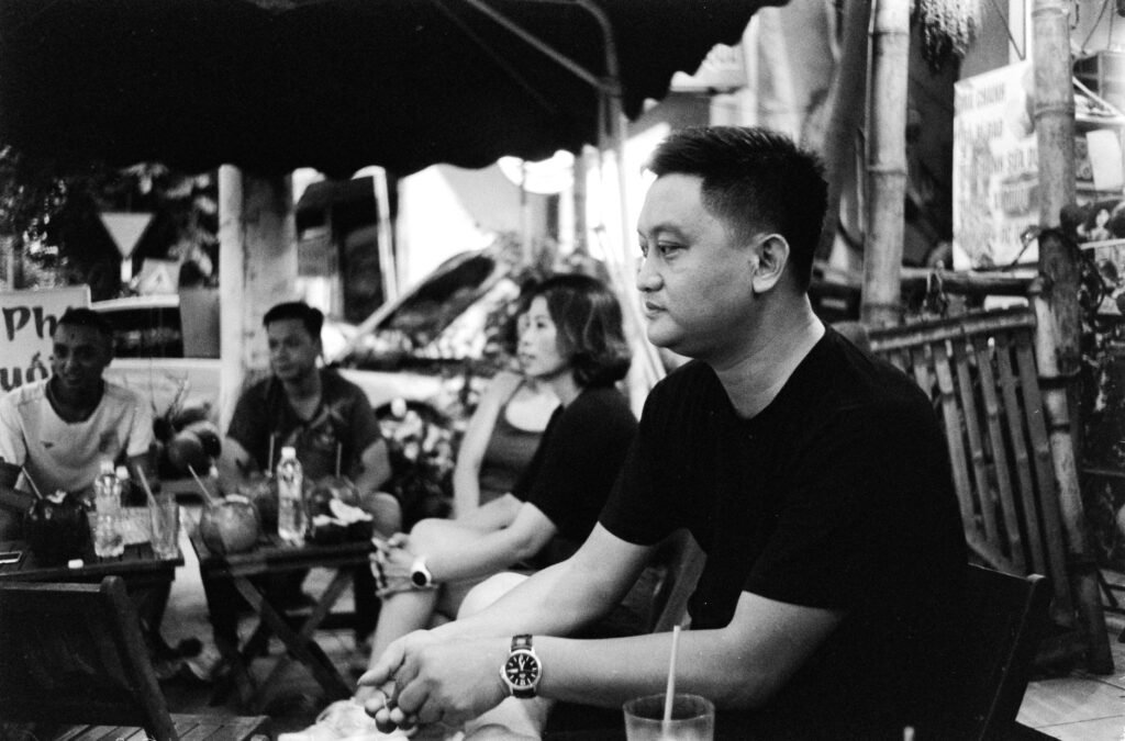 Two adults having a respectful conversation before an evening meeting