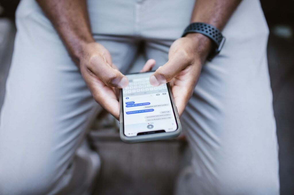 Adult checking a follow-up message on a smartphone