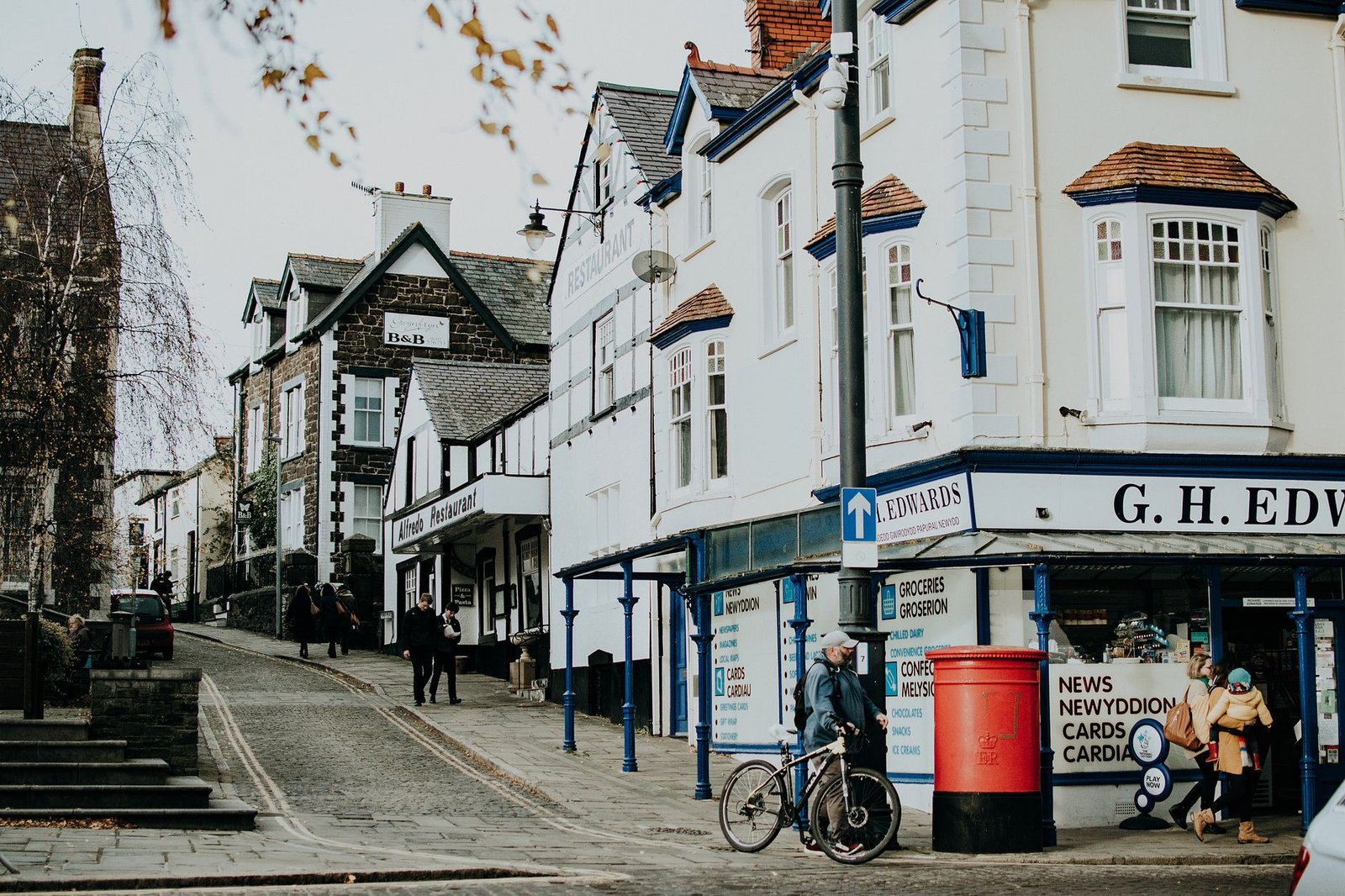 Charming town center with shops, people, and bicycles on a cobbled street. A perfect urban lifestyle capture.