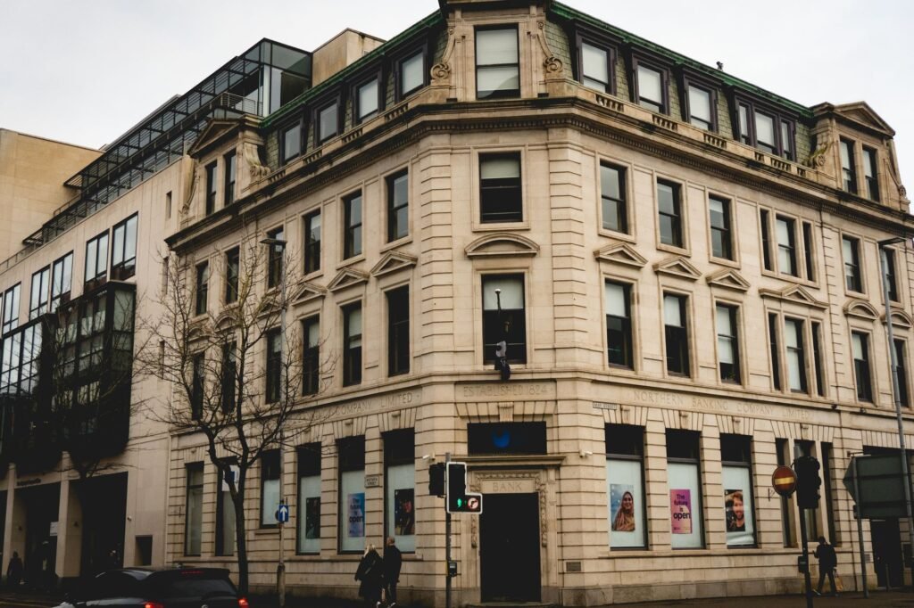 Street view of a historic building's facade in Belfast, Northern Ireland, showcasing traditional architecture.