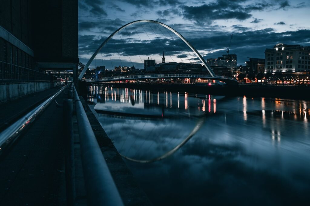 Two adults enjoying a relaxed evening walk beside the River Tyne
