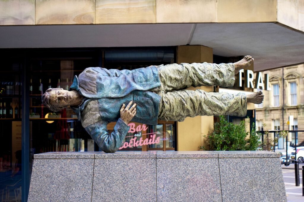 Artistic sculpture of a floating man in Newcastle upon Tyne. Unique urban outdoor art.