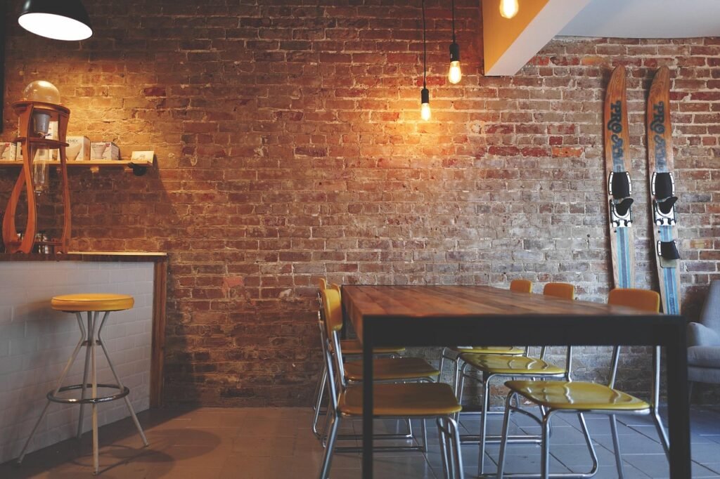 brick wall, chairs, furniture, interior design, lights, restaurant, table, rustic, interior decoration, restaurant, restauran