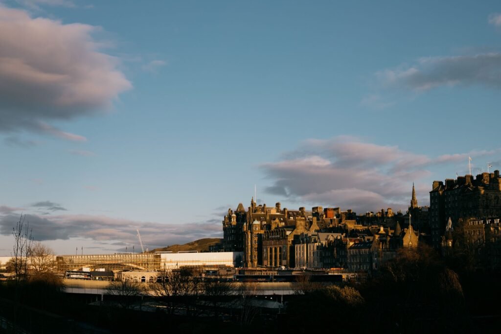 View of Edinburgh's historic architecture against a stunning sunset sky.