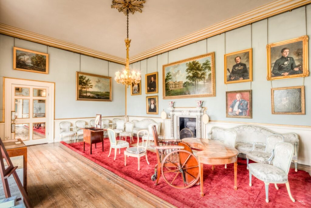 Explore the historic charm of Burton Constable Hall's elegantly furnished interior with vintage decor and fine art.