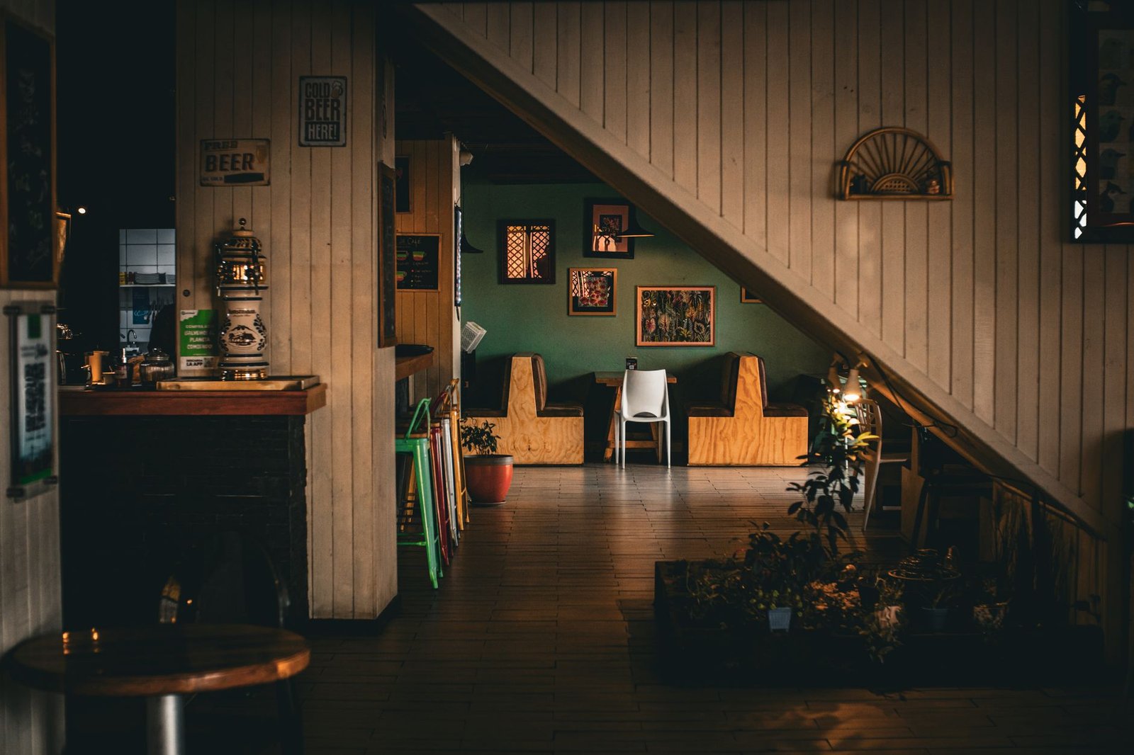 Warm and inviting rustic cafe interior with wooden decor and ambient lighting, perfect for a relaxed dining experience.