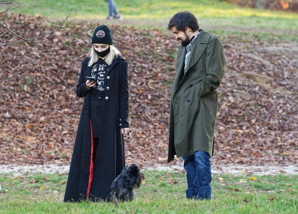 couple, face mask, dog park, walking the dog