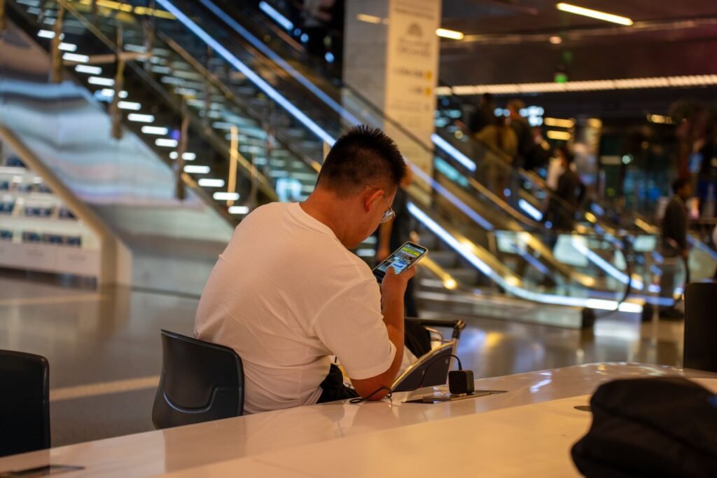 Traveller reviewing arrangements on a phone