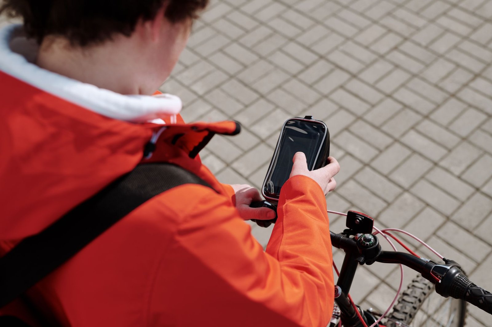 Person reviewing booking information on a smartphone in Ealing
