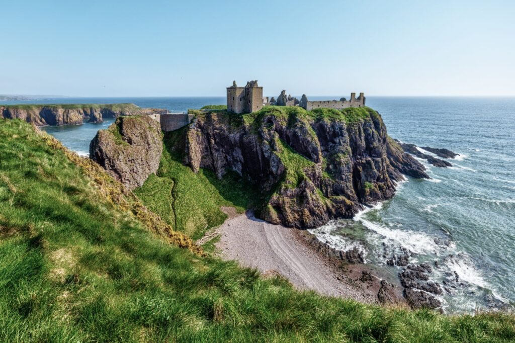 Stunning view of Dunnottar Castle perched on dramatic cliffs over the North Sea coastline.