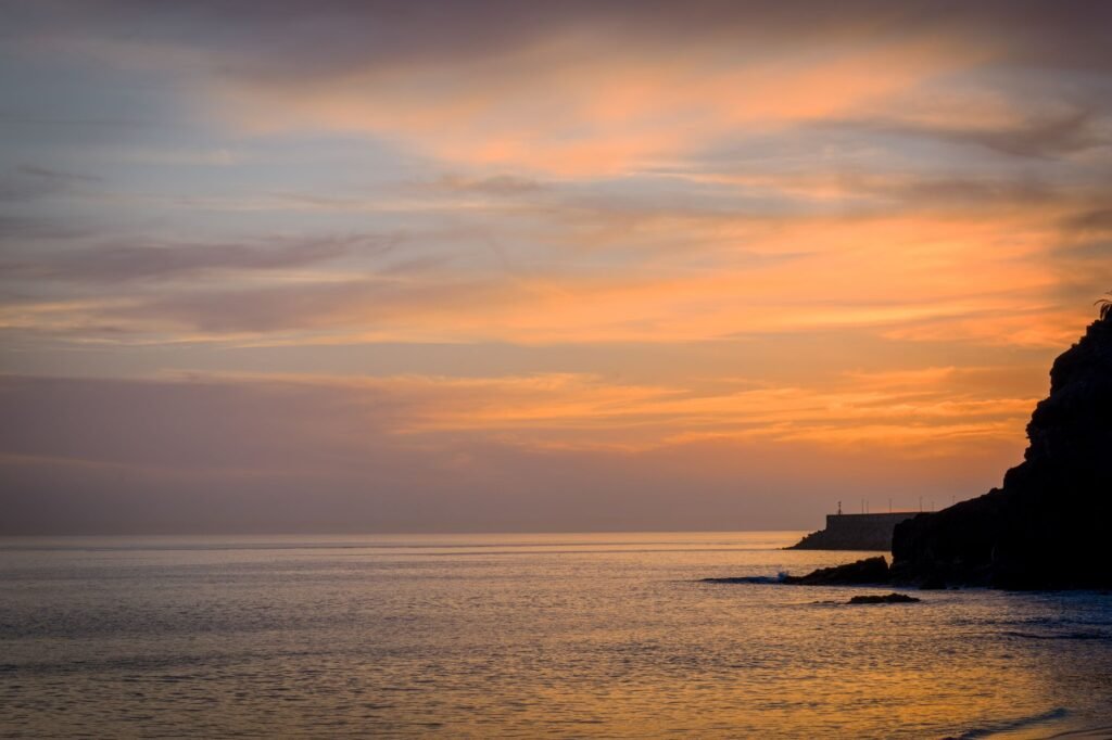 Stunning sunset view over the ocean with vibrant sky colors at the Canary Islands coast.