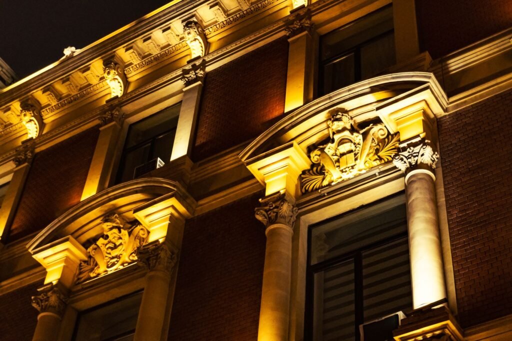 A striking night view of detailed classical architecture with elegant illumination.