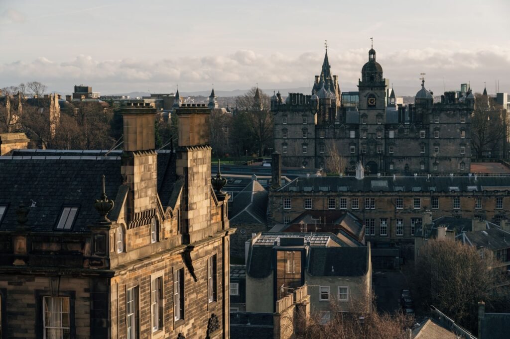 View of Edinburgh's historic architecture featuring St Giles Cathedral at dusk.