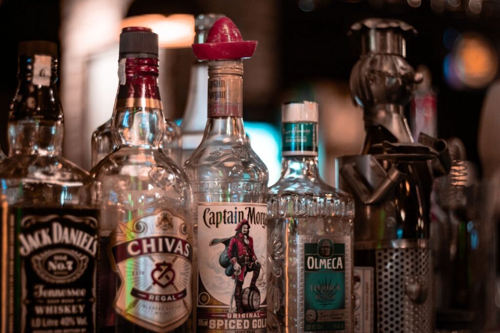 Close-up of various alcohol bottles on a bar shelf in Ankara, Türkiye.