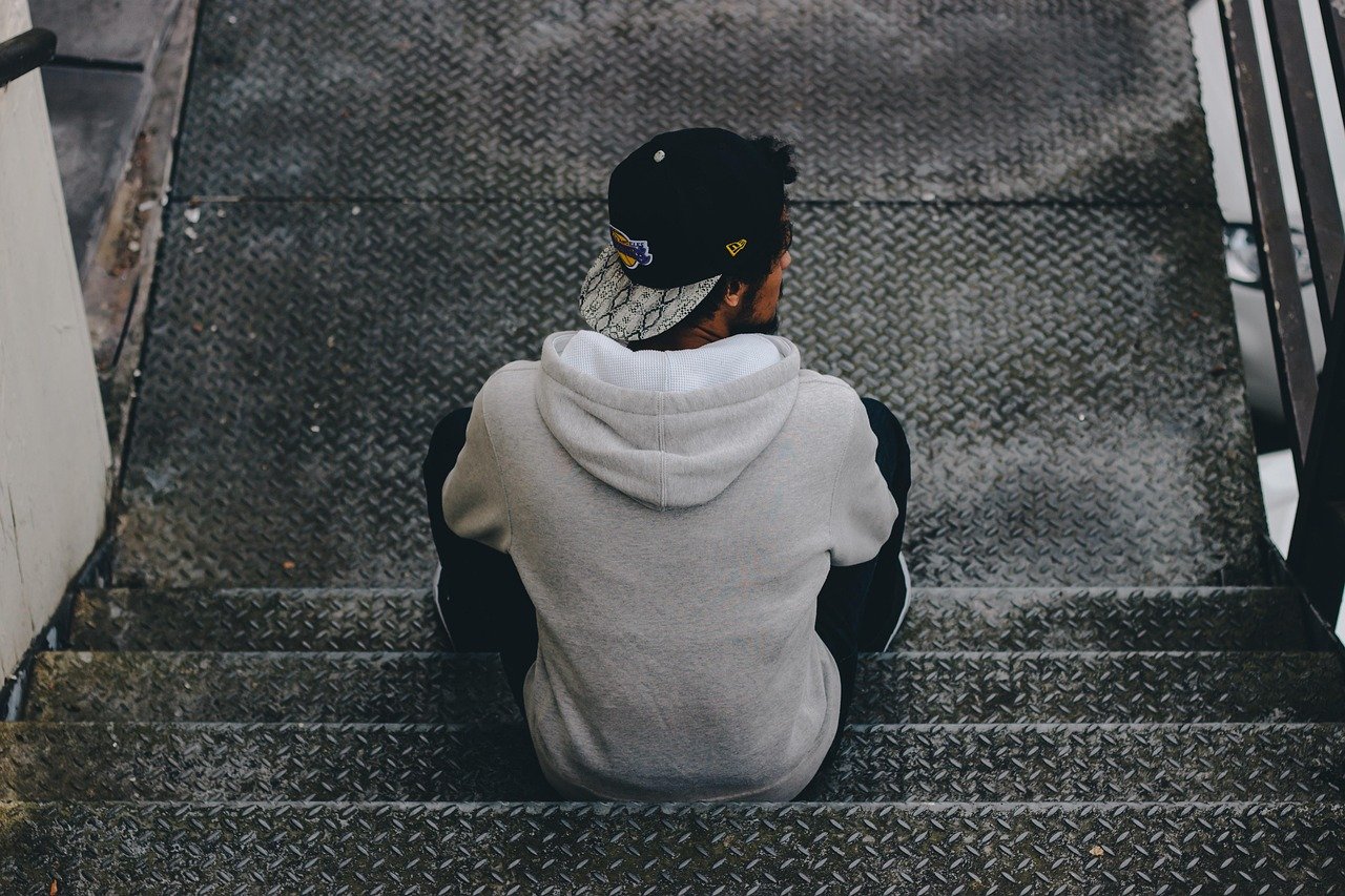 cap, man, model, person, sitting, staircase, stairs, walkway, gray model, England, United Kingdom, Birmingham