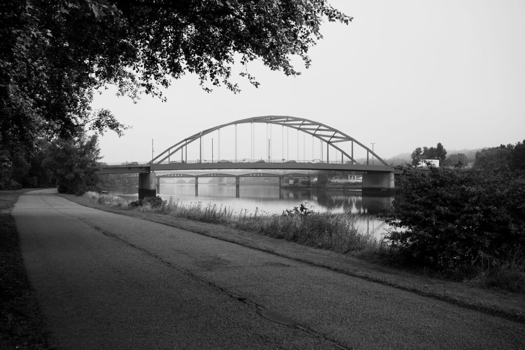 Monochrome view of Scotswood Bridge crossing River Tyne, Newcastle upon Tyne.